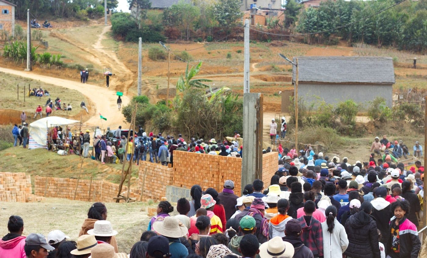 Members of the Olokoro community standing together at a meeting